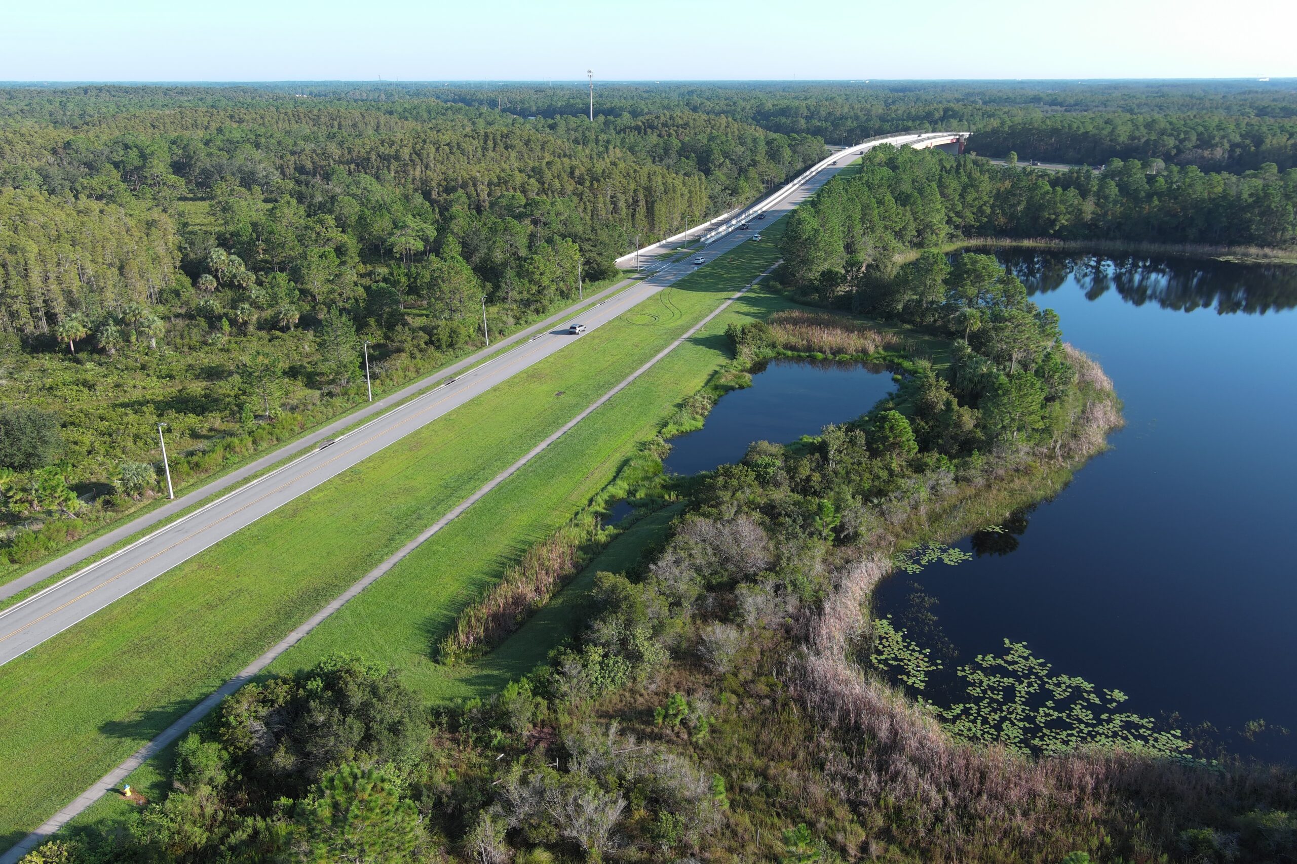 Aerial of drainage pond along roadway