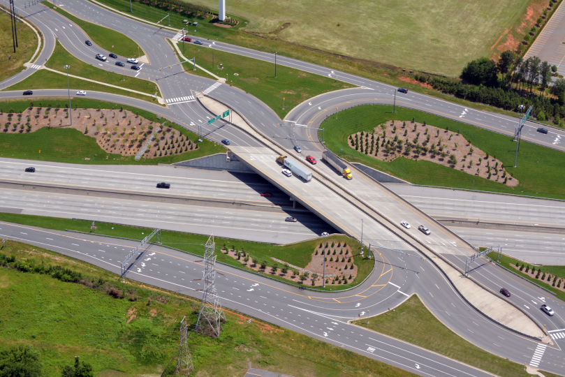 Aerial view of NC73-I85 divergence diamond interchange with cars and trucks