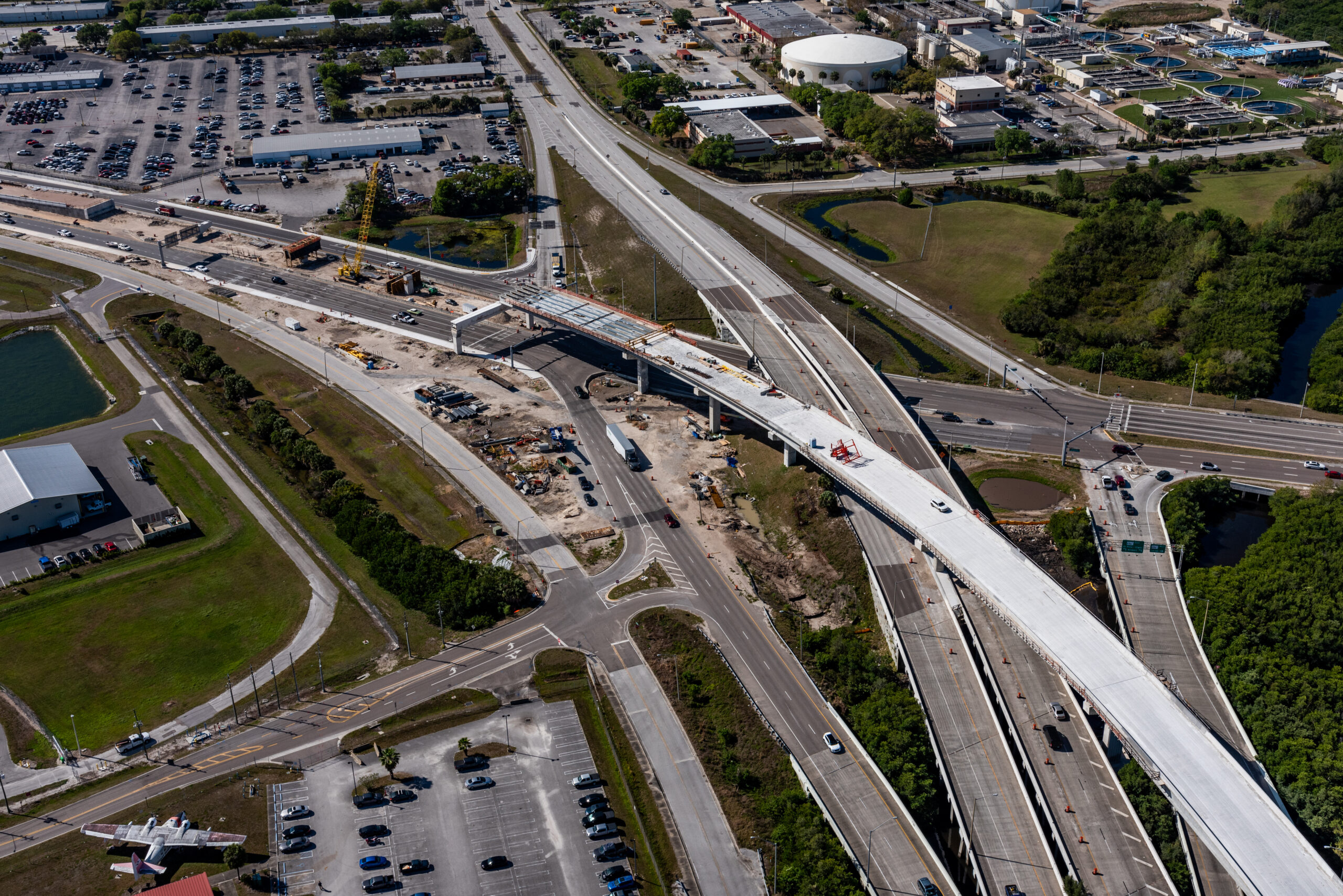 Aerial view of highway construction at Pinellas Gateway Expressway, showing multiple overpasses and surrounding areas