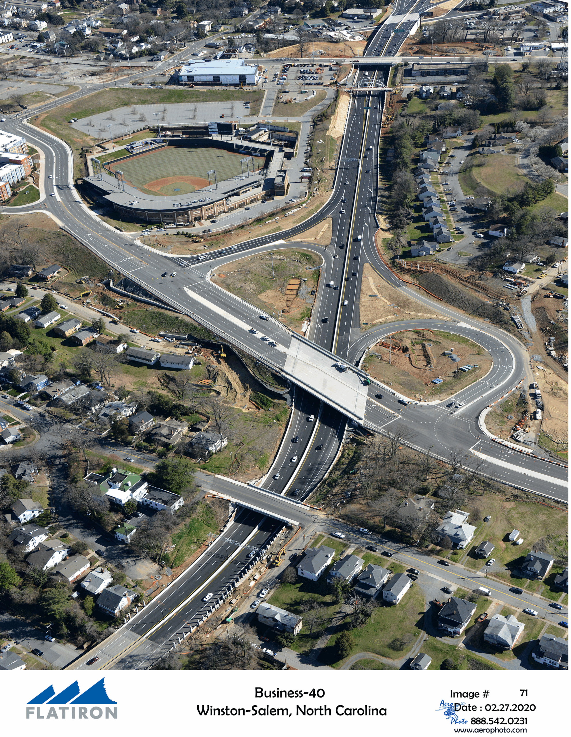 Aerial view of Business-40 highway in Winston-Salem, North Carolina, featuring surrounding residential areas and a baseball stadium