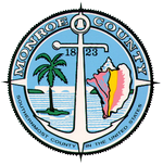 Monroe County seal with palm tree, sailboat, conch shell, anchor, 