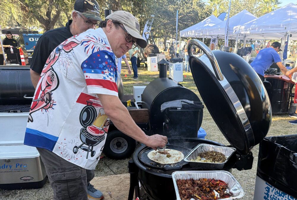Vice President of KCA grilling for a cause at PigJig in Tampa