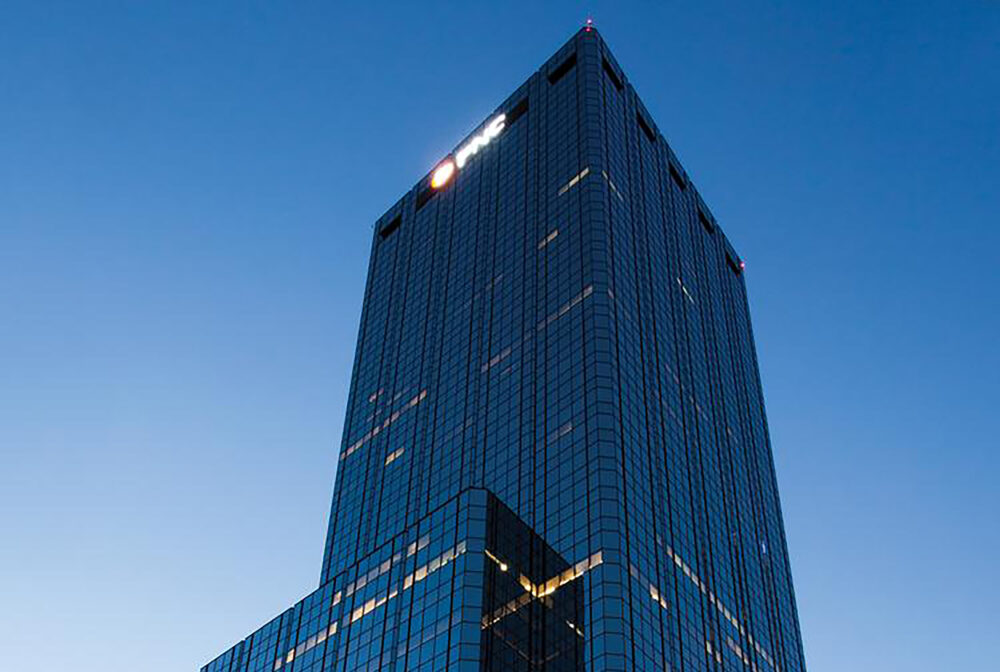 Skyscraper against evening sky with prominent PNC logo at top