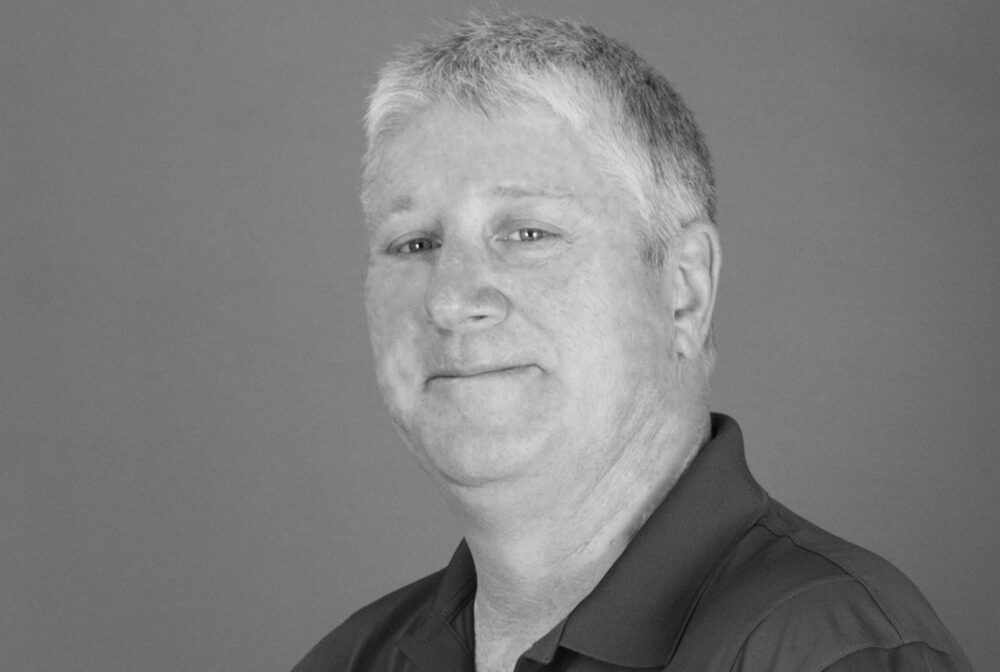 Sean Foley in black and white portrait, slight smile, neutral expression