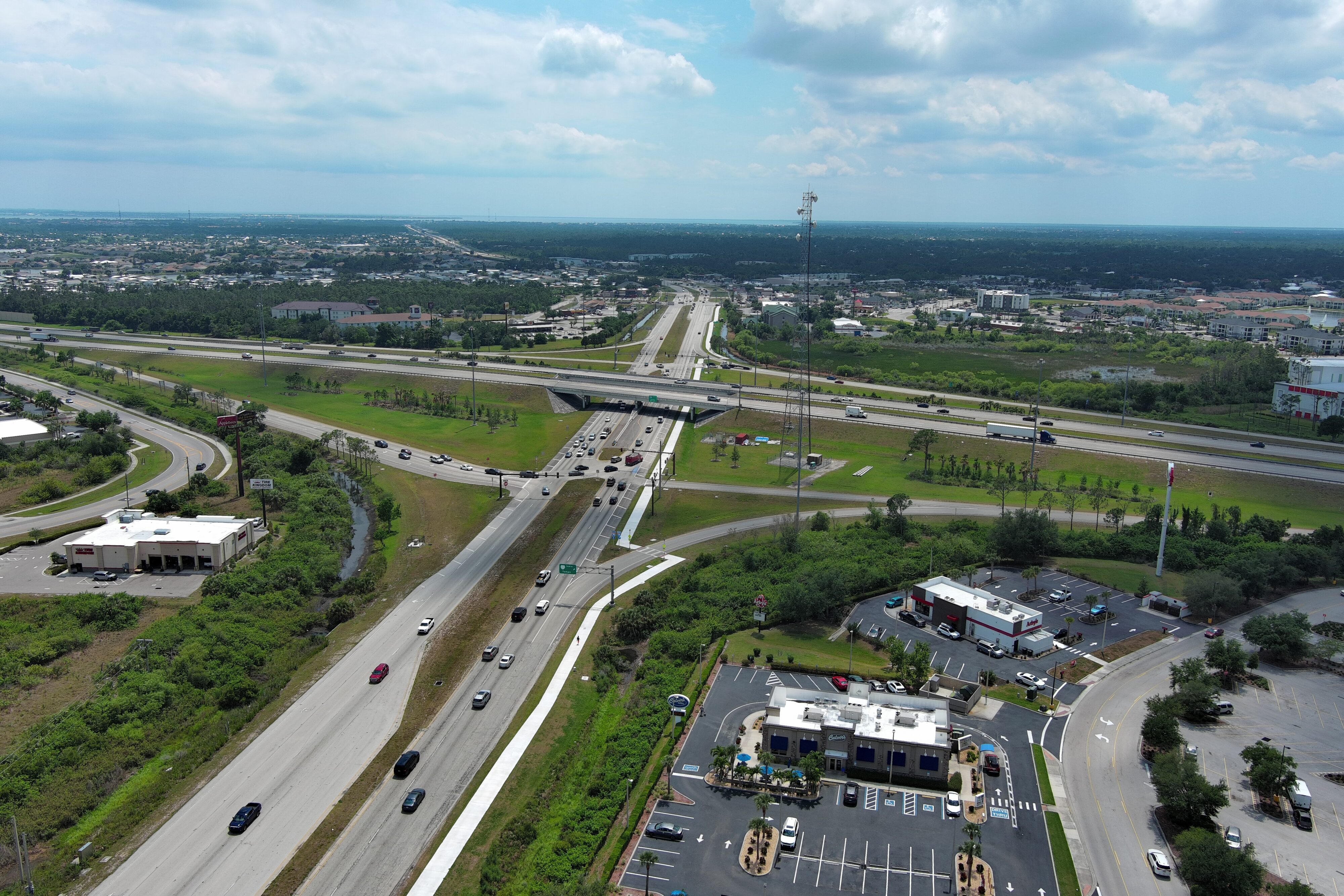 Aerial view of I-75 intersection with Kings Highway, showing traffic flow and surrounding greenery