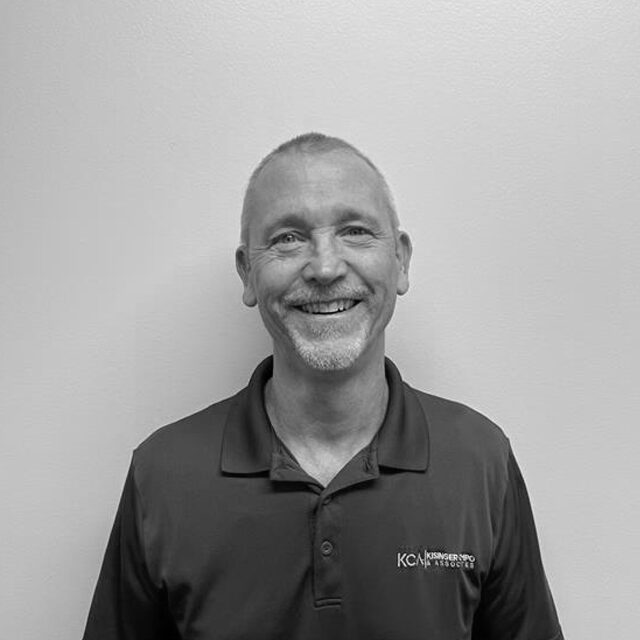 Smiling man in a polo shirt with "KCA, Kansas City Audio Visual" logo