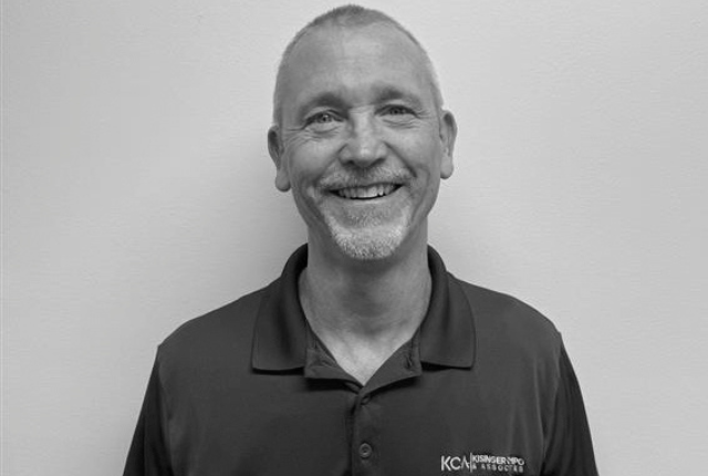 JimKelley.png smiling in a polo shirt with "KCA" logo on it