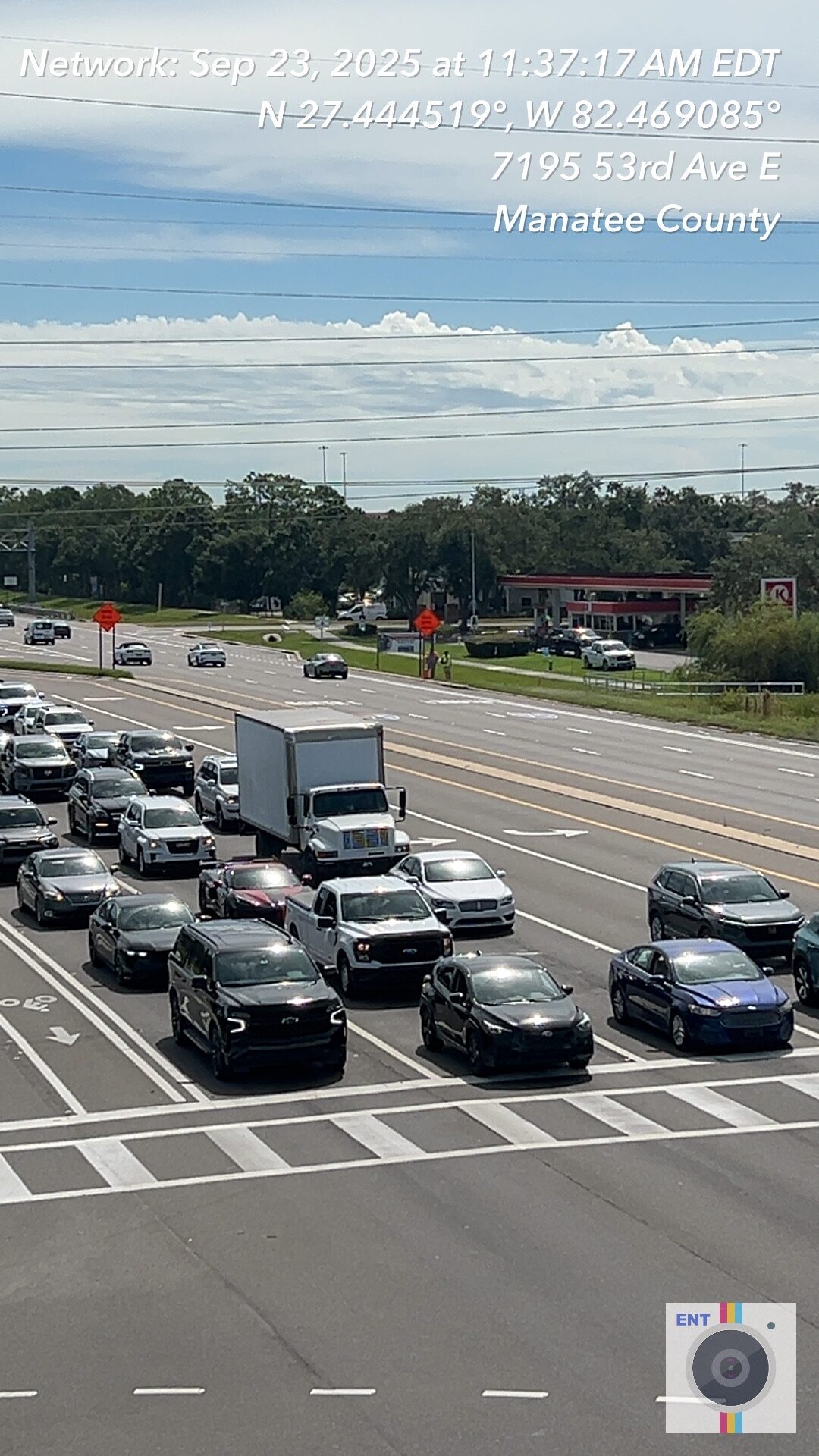 Traffic at intersection with cars and truck, location details overlayed, Manatee County