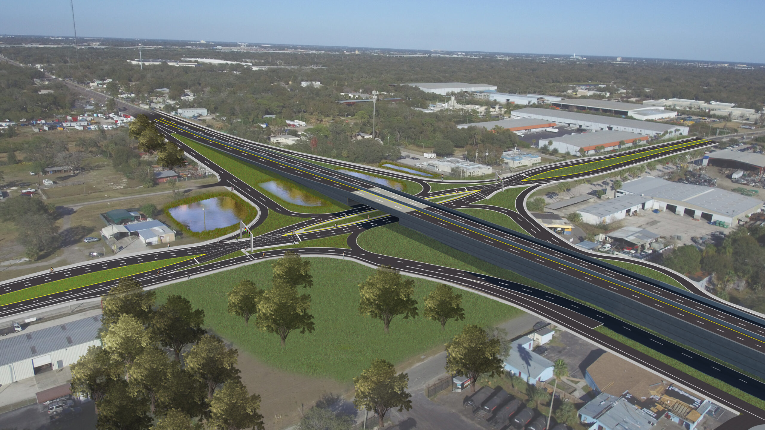 Aerial view of US41-DDI highway interchange with looped ramps and overpass surrounded by green spaces, residential, and industrial areas
