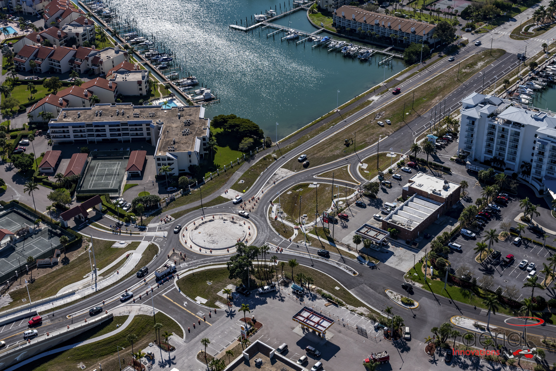 Aerial view of Pinellas Bayway featuring a newly constructed roundabout near marina and residential buildings