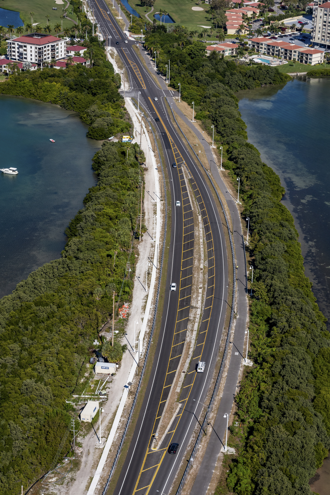 Aerial view of Pinellas Bayway road flanked by water and greenery