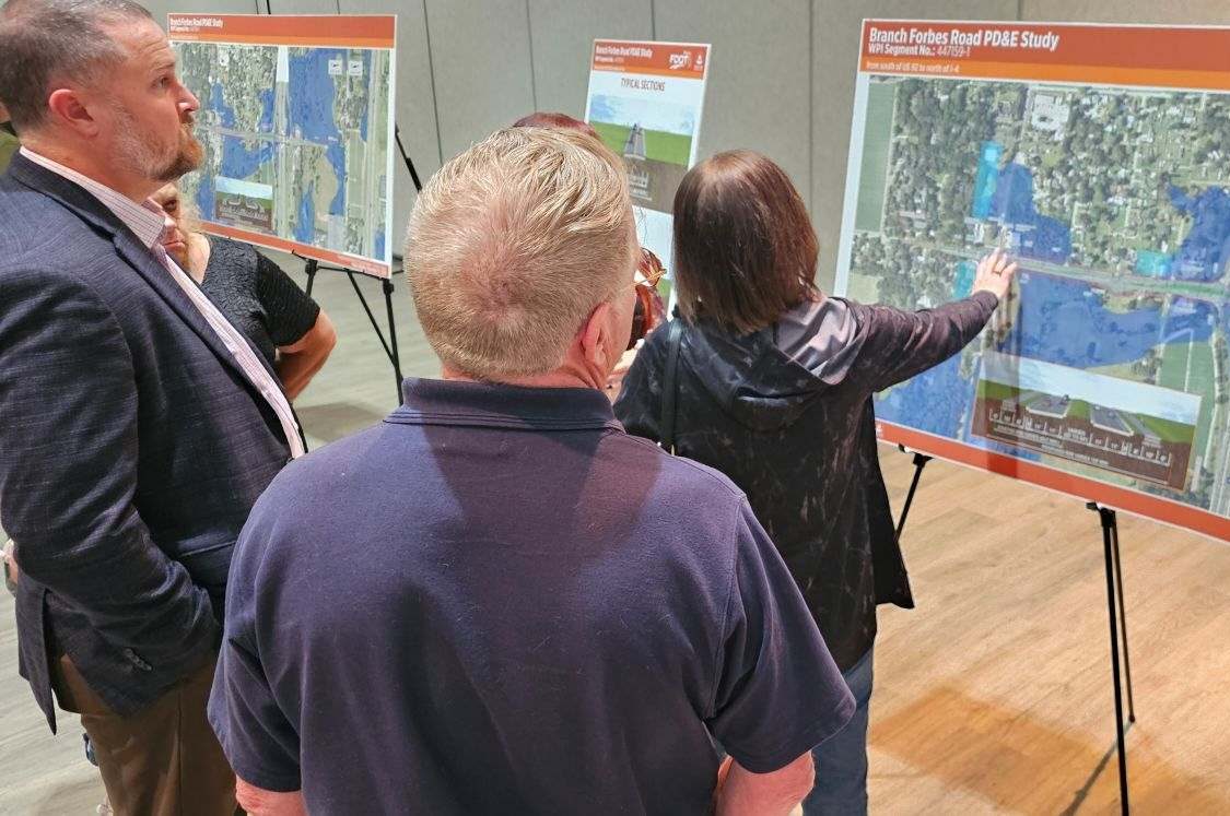 People discussing "Branch Forbes Road PD&E Study" map displays